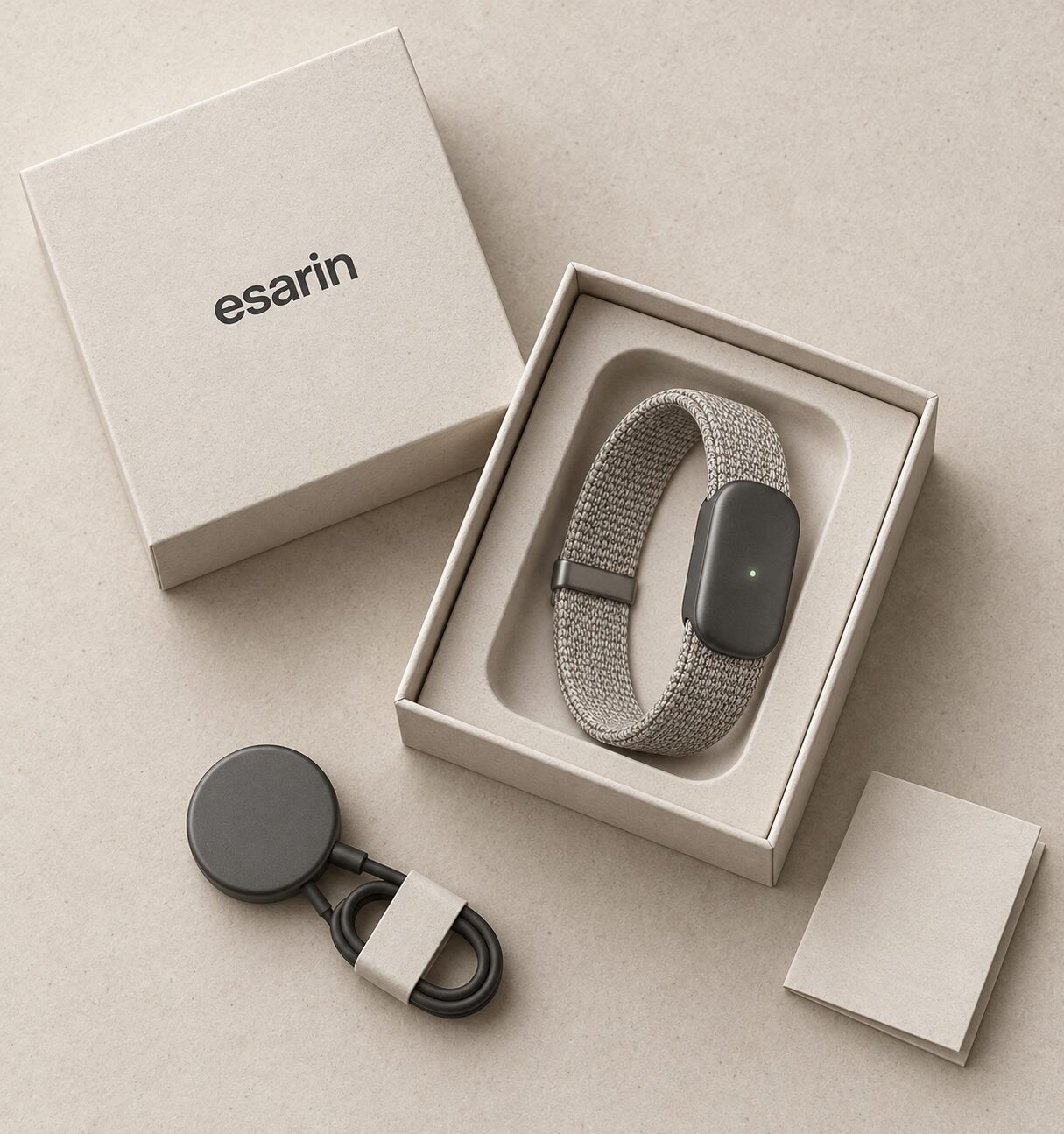 The esarin box opened, showing the band and its charger.